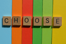 letters spelling the word choose on a colourful background