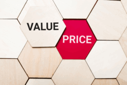 a jigsaw of wooden-hexagon shapes, one with value and one with price on it.